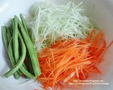 A picture of step 1 of Som Tum Spring Rolls (Papaya Salad Spring Rolls).