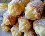 Foto del passaggio 6 della ricetta Cannoli di sfoglia con crema pasticcera