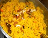 A picture of step 6 of Basanti polau (yellow rice).