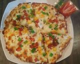 A picture of step 3 of Veg spicy pizza.