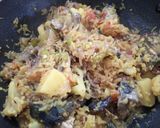 A picture of step 8 of Muri ghonto/Bengali fish head with rice.