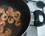 A picture of step 1 of Tom yum shrimp rice.