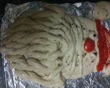 A picture of step 12 of Garlic Bread Santa.