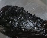 A picture of step 1 of Baingan Bharta (वांग्याचे भरीत).