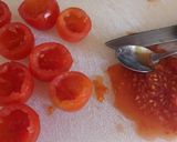A picture of step 2 of Pomordorini e caprino cherry tomatoes stuffed with goat's cheese.