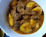 A picture of step 7 of Alu gosht.