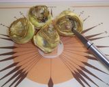 Foto del paso 2 de la receta Medallones de merluza rebozados, setas y alcachofas