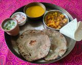 A picture of step 11 of Kathiyawadi thali with real desi tadka.