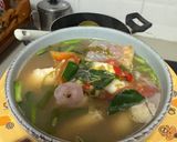 รูปขั้นตอนการทำที่ 3 ของ ต้มส้มปลาทับทิมใส่ใบมะขามอ่อน