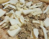 A picture of step 6 of Malai boti pizza with white sauce.