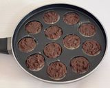 A picture of step 10 of Healthy Atta Jaggery Muffins in Appe Pan.
