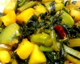 A picture of step 2 of Pui shaaker chochhori (Malabar Spinach with mixed vegetables).