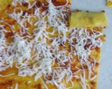 A picture of step 3 of Schezwan cheesy khandvi.