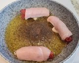 Foto del paso 7 de la receta: Rollitos de pollo y jamón en salsa de pimientos del piquillo