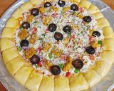 A picture of step 4 of Cheesy Bites Tikka Pizza 🍕🍕.