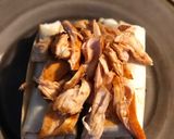 A picture of step 4 of STEAK and SHREDDED CHICKEN BURRITOS WITH MELTED CHEESE/FRITOS: JAYS SMOTHERED BURRITO.