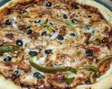 A picture of step 6 of Chicken fajita pizza.
