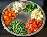 A picture of step 1 of Aloo Matar Gobhi Sabzi.
