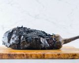 A picture of step 1 of Baingan Bharta (Smoky Eggplant Curry).