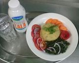 A picture of step 8 of Mashed Matoke, fried sukumawiki, Raw carrots n tomatoes.