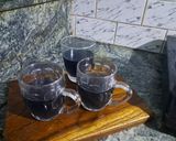 A picture of step 2 of Cinnamon butterfly pea tea.
