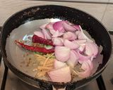 A picture of step 3 of Paneer Jalfrezi with steamed white rice.