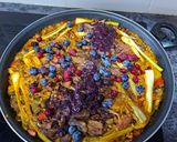 A picture of step 13 of Duck Breast Paella with Cranberries.