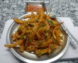 A picture of step 7 of Chilli potato fries.