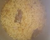 A picture of step 7 of Onion turmeric pulao wrapped in egg.
