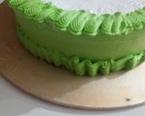 A picture of step 14 of Cricket 🏏 theme cake.