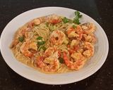 A picture of step 6 of Poached Shrimp with Siriacha Cream Sauce on Angel Hair Pasta.