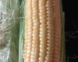 A picture of step 1 of CHEESY BUTTERI CORN on COB.