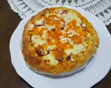 A picture of step 5 of Pizza covered with homemade Mozzarella Cheese & Sausage.