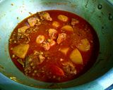 A picture of step 15 of Karahi style alu matr chicken ka salen.