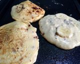 A picture of step 10 of Hawaii macadamia nut chocolate banana pancake recipe.