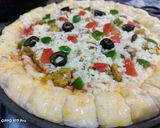 A picture of step 3 of Corners Cheese filled pizza.