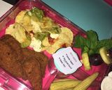 A picture of step 1 of Nachos, crumbed chicken pieces, mini corn cobs, pineapple grape and mint fruit skewer.
