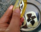 A picture of step 4 of Yummy Oreo white chocolates in cups.