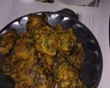A picture of step 5 of Palak bhajiye with tea or tomato chutney.