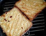 A picture of step 6 of Cheesy Egg Toast Grilled Sandwich.