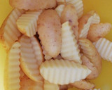 Foto del paso 4 de la receta: Patatas gajo picantes