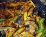 A picture of step 5 of Achari Aloo Baingan.