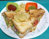 A picture of step 7 of Schezwan Cheese Toast Sandwich (A Mumbai road-side delight).