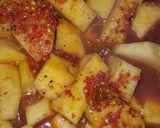 A picture of step 4 of Yam porridge garnished with mint leaf for coolness.