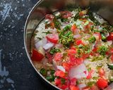 A picture of step 3 of Besan onion tomato chilla.