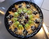 Une image de l'étape 10 de Fleurs de courgettes farcies aux crevettes tomates cerises noires et deux fromages.