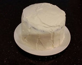 A picture of step 21 of Mocha Layer Cake with Whipped Mascarpone Cream and a Coffee Glaze Drizzle.