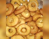 A picture of step 8 of Cardamon donuts with chocolate glaze.