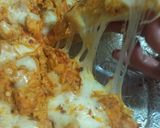 A picture of step 6 of Chéésy cheese 🧀 chicken 🐔 pizza 🍕🍕.