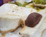 A picture of step 5 of 3 layered Cadbury and kiwi grapes Cheese cake 2 in 1.